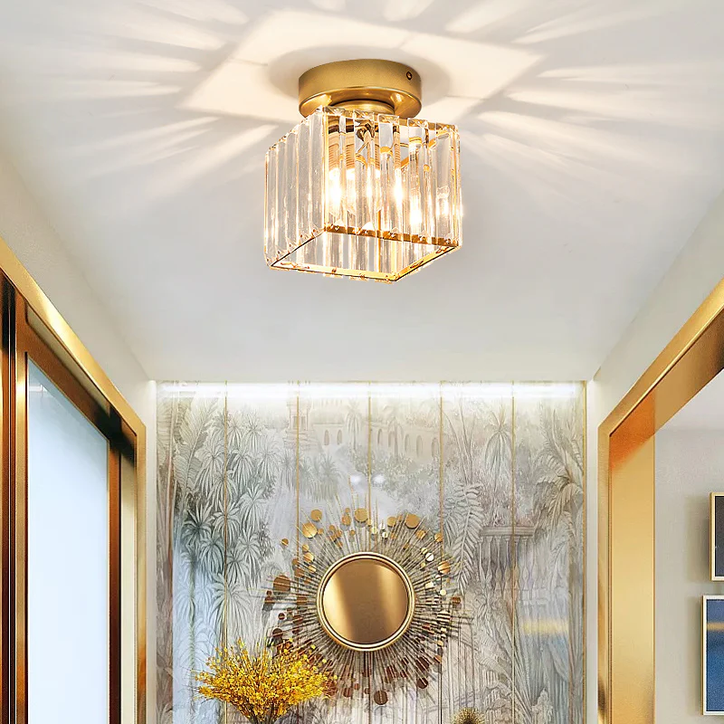 Modern black crystal flush mount ceiling light, sleek brass fixture, crystal shade, ideal for rooms with low ceilings.