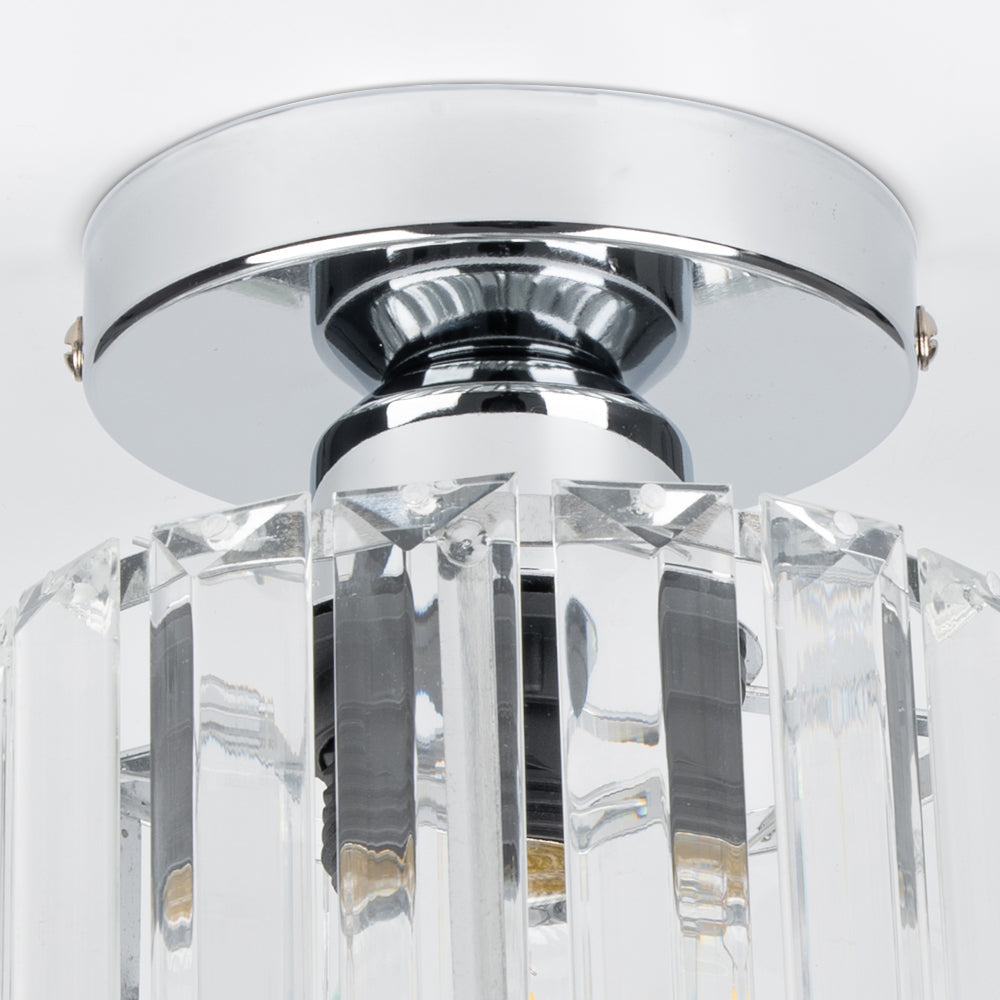 Modern black crystal flush mount ceiling light, sleek brass fixture, crystal shade, ideal for rooms with low ceilings.