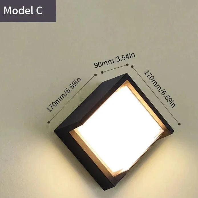 Modern black LED outdoor wall light with motion sensor, waterproof ABS, enhances security, suits balconies, porches, gardens.