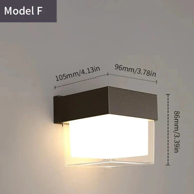 Modern black LED outdoor wall light with motion sensor, waterproof ABS, enhances security, suits balconies, porches, gardens.