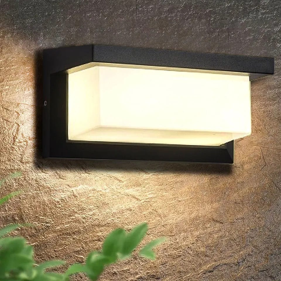 Modern black LED outdoor wall light with motion sensor, waterproof ABS, enhances security, suits balconies, porches, gardens.