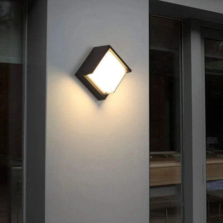 Modern black LED outdoor wall light with motion sensor, waterproof ABS, enhances security, suits balconies, porches, gardens.