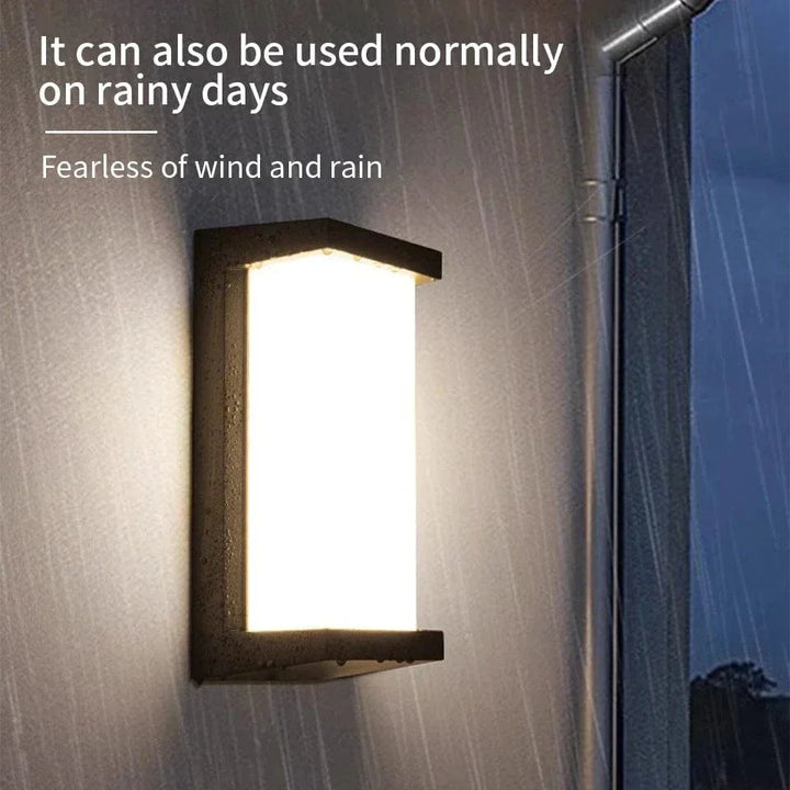Modern black LED outdoor wall light with motion sensor, waterproof ABS, enhances security, suits balconies, porches, gardens.
