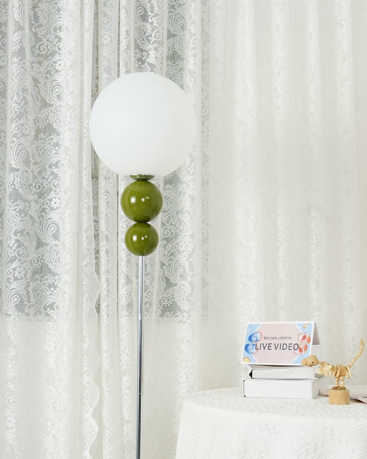Modern Clavel metal floor lamp with glass accent, 59-inch height, sleek modern design, adds elegance to any room decor.