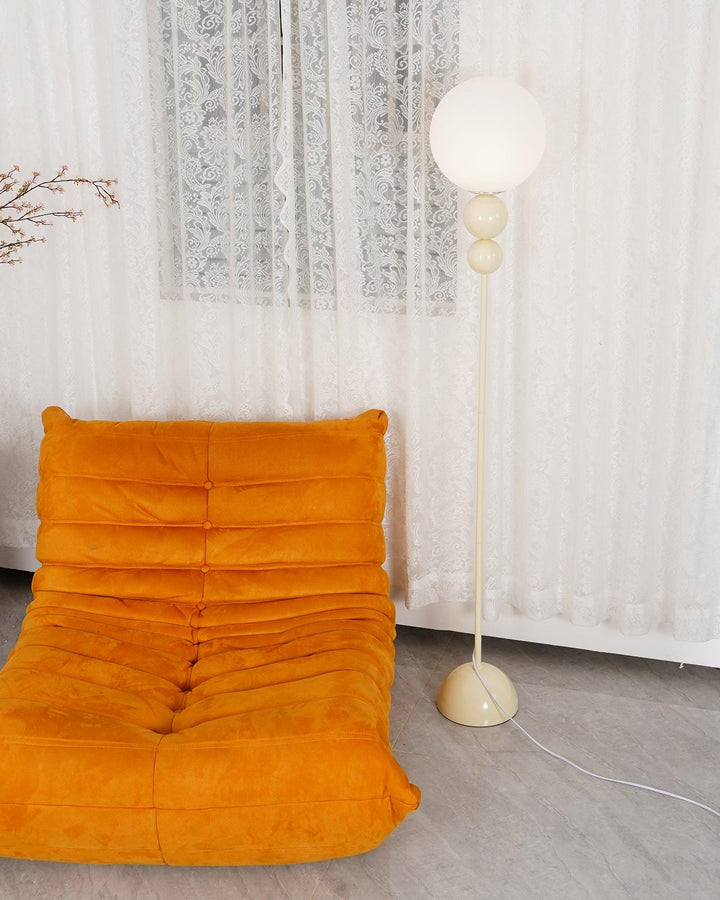Modern Clavel metal floor lamp with glass accent, 59-inch height, sleek modern design, adds elegance to any room decor.
