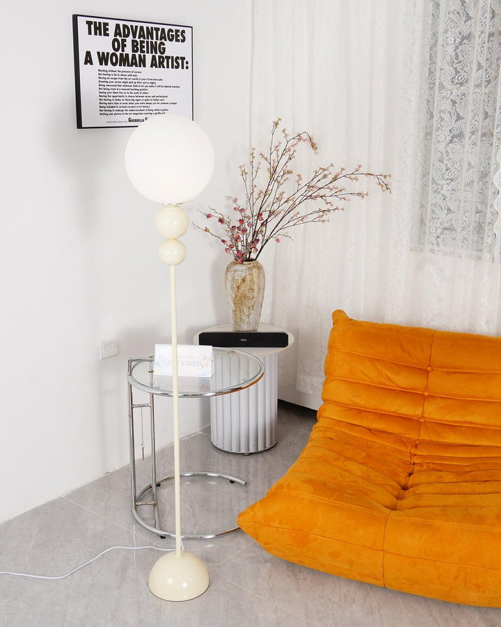 Modern Clavel metal floor lamp with glass accent, 59-inch height, sleek modern design, adds elegance to any room decor.