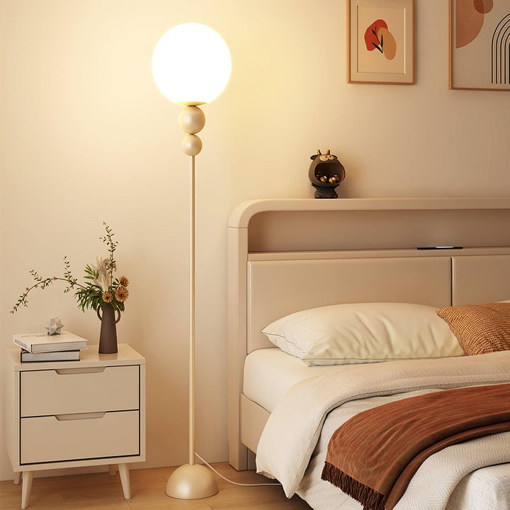Modern Clavel metal floor lamp with glass accent, 59-inch height, sleek modern design, adds elegance to any room decor.
