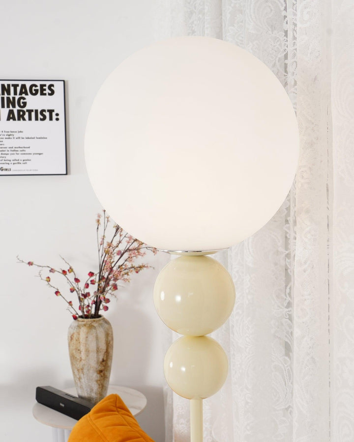 Modern Clavel metal floor lamp with glass accent, 59-inch height, sleek modern design, adds elegance to any room decor.