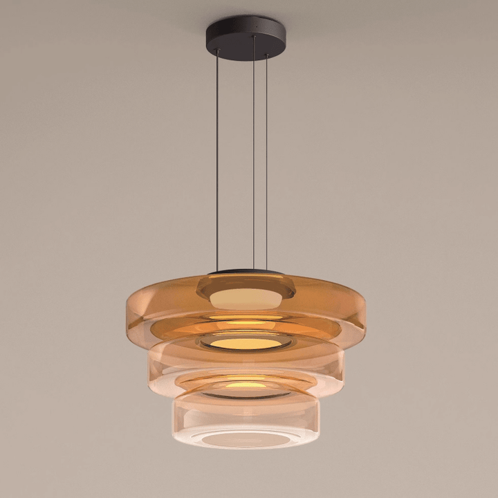 "Modern glass pendant lamp in Bauhaus design, smoke grey shade, adjustable cable, warm LED glow, ideal for home interiors."