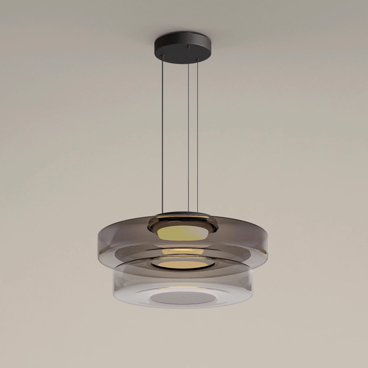 "Modern glass pendant lamp in Bauhaus design, smoke grey shade, adjustable cable, warm LED glow, ideal for home interiors."