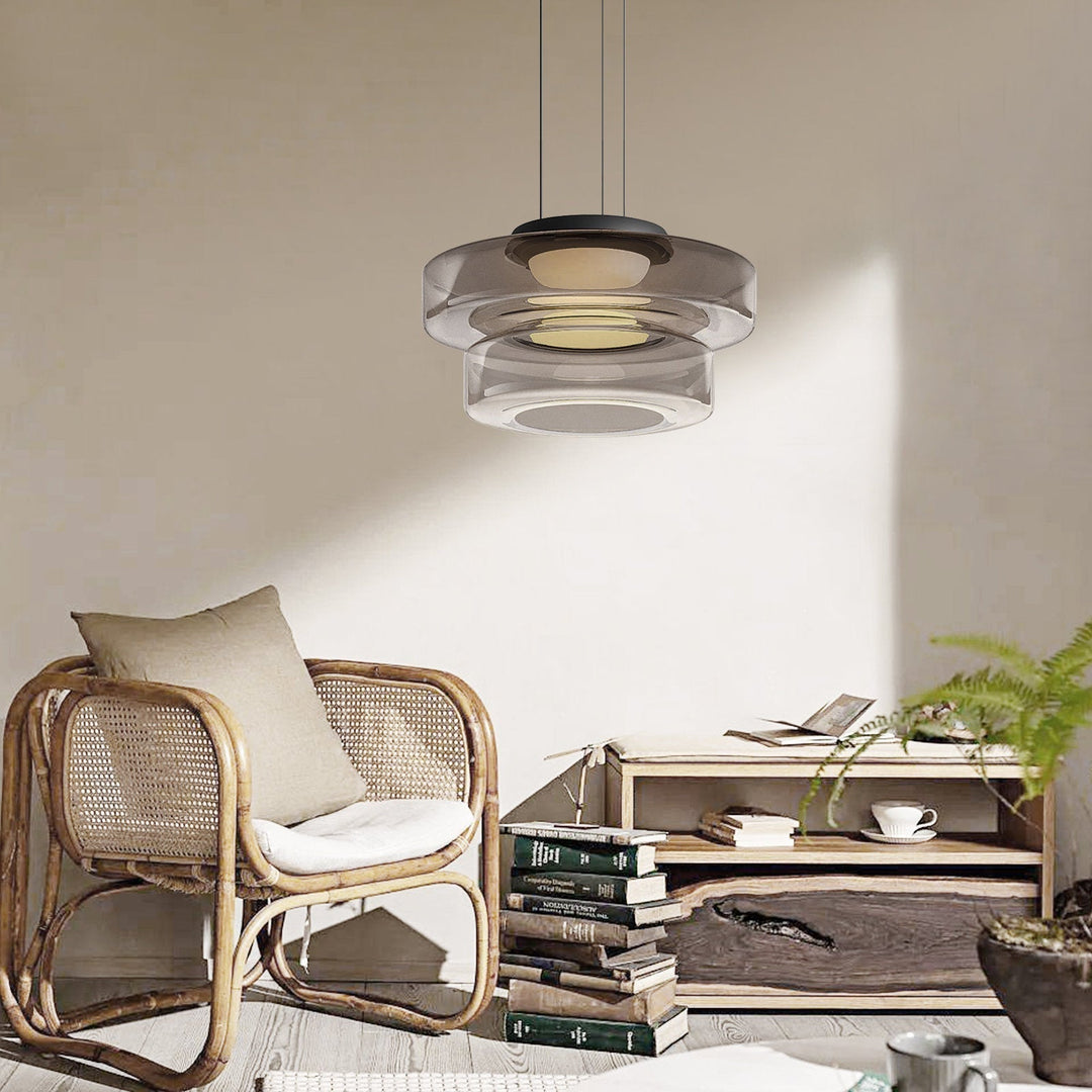 "Modern glass pendant lamp in Bauhaus design, smoke grey shade, adjustable cable, warm LED glow, ideal for home interiors."