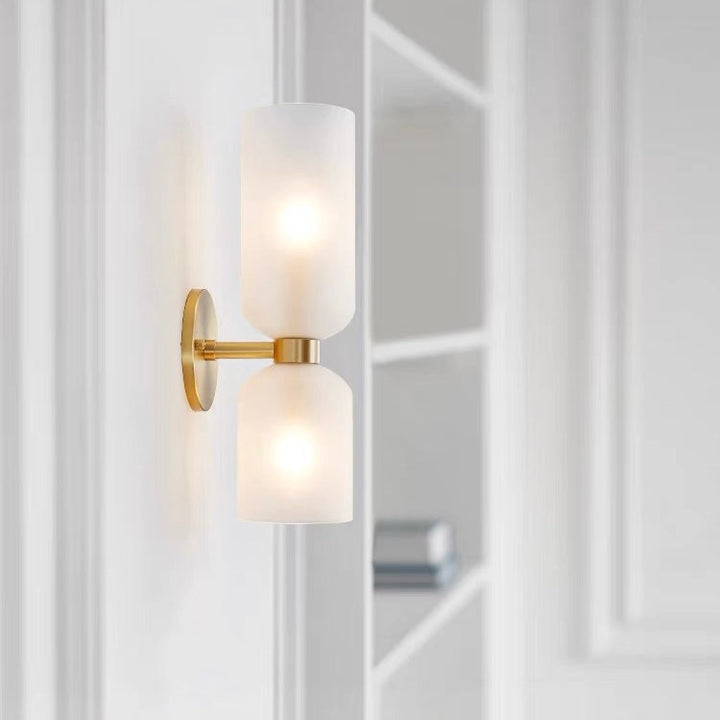 "Modern glass twin wall light with dual glass shades, ideal for stylish interiors, adding elegance and versatile illumination