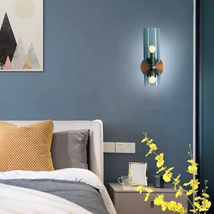 "Modern glass twin wall light with dual glass shades, ideal for stylish interiors, adding elegance and versatile illumination
