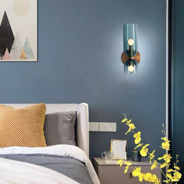 "Modern glass twin wall light with dual glass shades, ideal for stylish interiors, adding elegance and versatile illumination