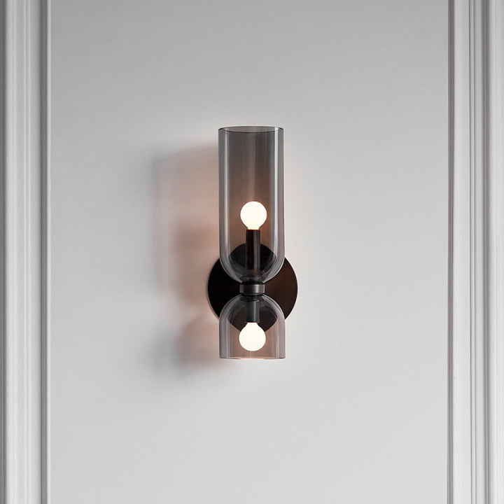 "Modern glass twin wall light with dual glass shades, ideal for stylish interiors, adding elegance and versatile illumination