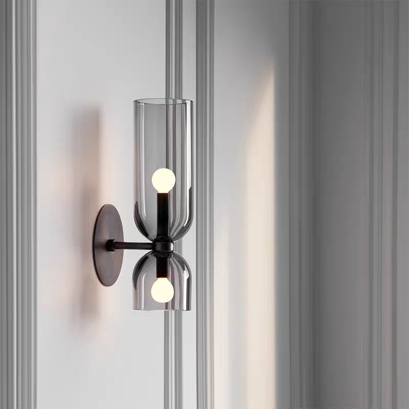 "Modern glass twin wall light with dual glass shades, ideal for stylish interiors, adding elegance and versatile illumination