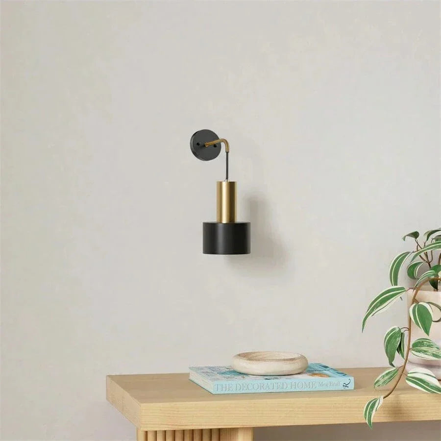 "Modern gold and black battery wall lamp with remote control, enhancing indoor ambiance with adjustable brightness levels."