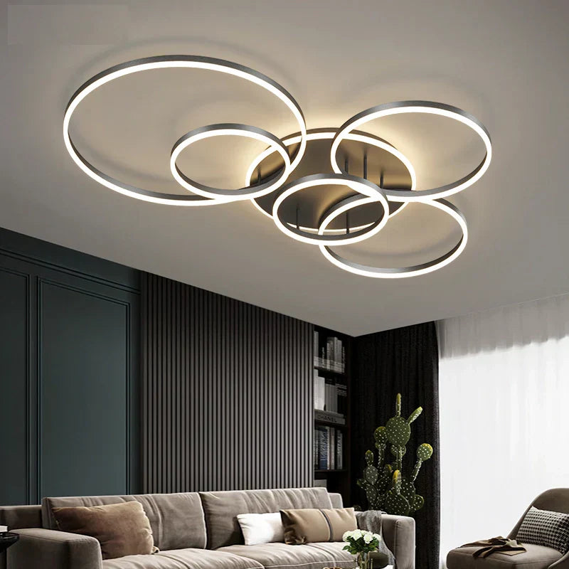 Modern LED ceiling light with black rings, chic design enhances room ambiance, suitable for spaces up to 30 sqm.