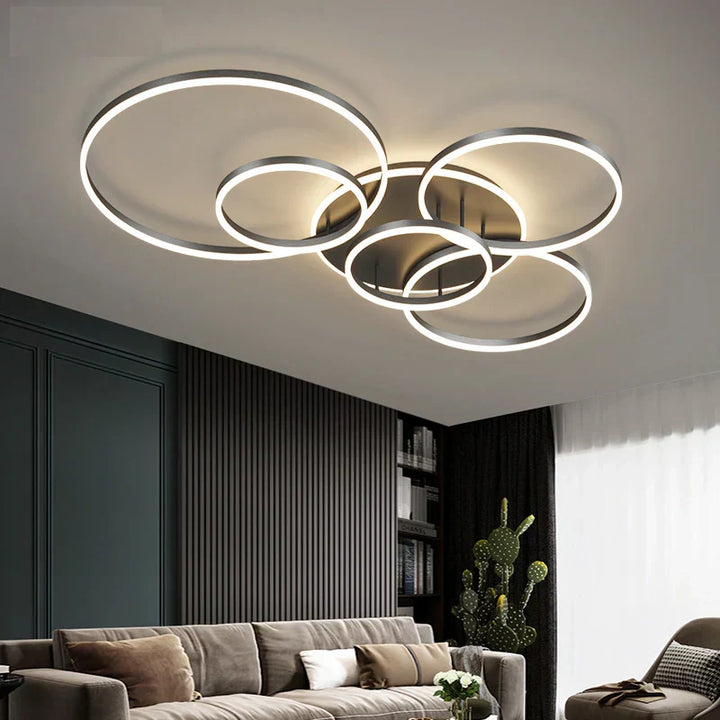 Modern LED ceiling light with black rings, chic design enhances room ambiance, suitable for spaces up to 30 sqm.