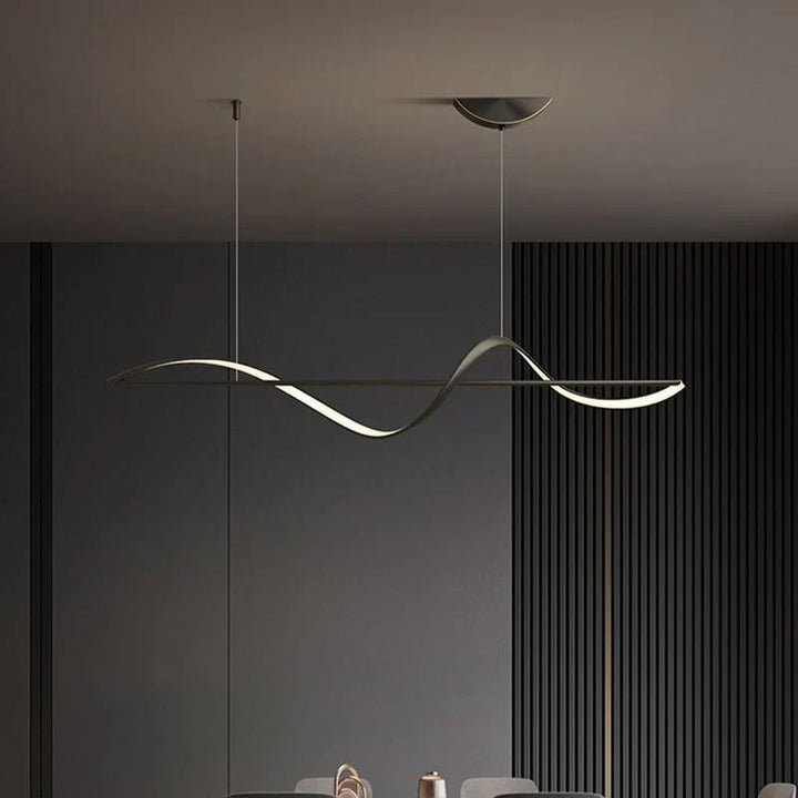 Modern LED pendant lamp with wavy metal and acrylic design, providing elegant illumination for stylish interior decor.