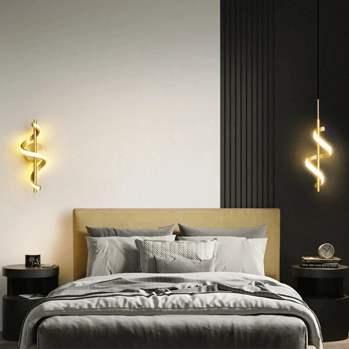 Modern LED wall sconce with adjustable gold arm and copper finish, ideal for ambient lighting in living rooms and bedrooms.