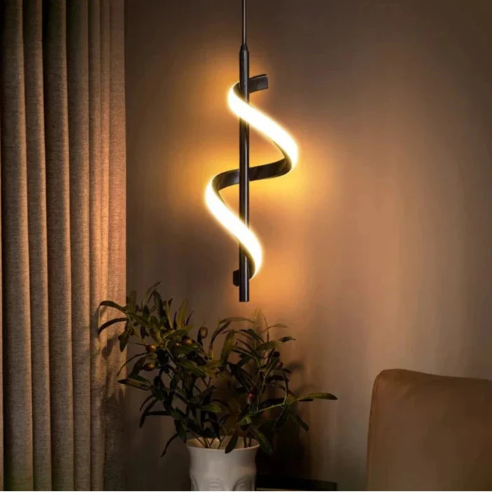 Modern LED wall sconce with adjustable gold arm and copper finish, ideal for ambient lighting in living rooms and bedrooms.