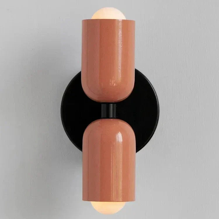 "Modern Nordic wall lamp with colorful metal design, dual light source, and sleek finish for contemporary interiors."