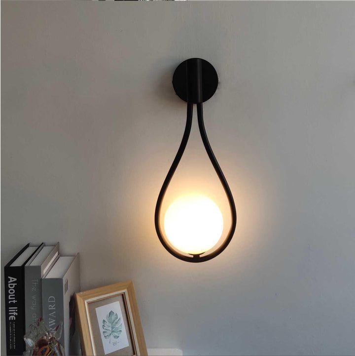 "Modern Nordic wall lamp with elegant gold and black finish, featuring minimalist design and clean lines for any room decor."