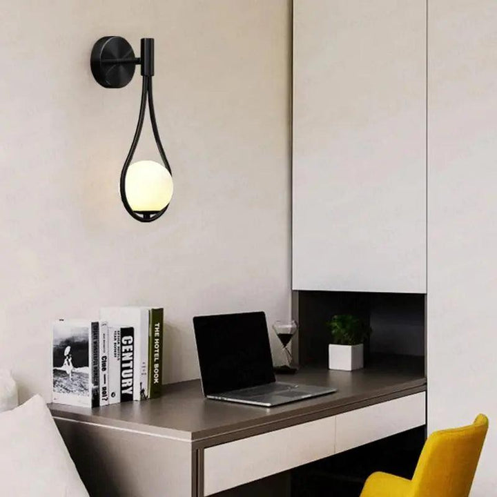 "Modern Nordic wall lamp with elegant gold and black finish, featuring minimalist design and clean lines for any room decor."