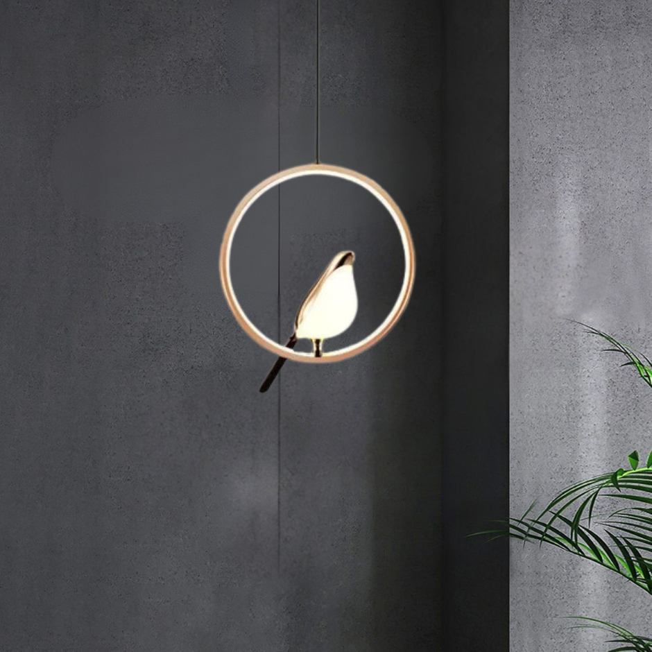 "Modern pendant light with elegant golden bird design in a minimalist frame, ideal for serene home environments."