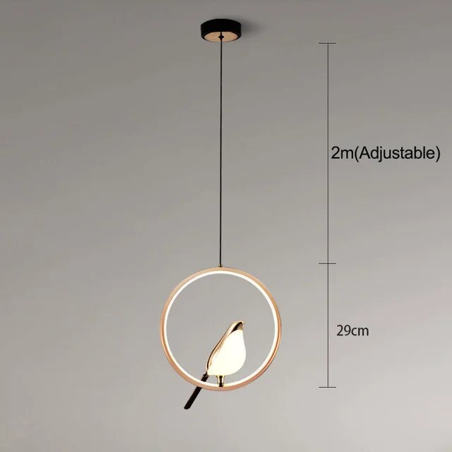 "Modern pendant light with elegant golden bird design in a minimalist frame, ideal for serene home environments."
