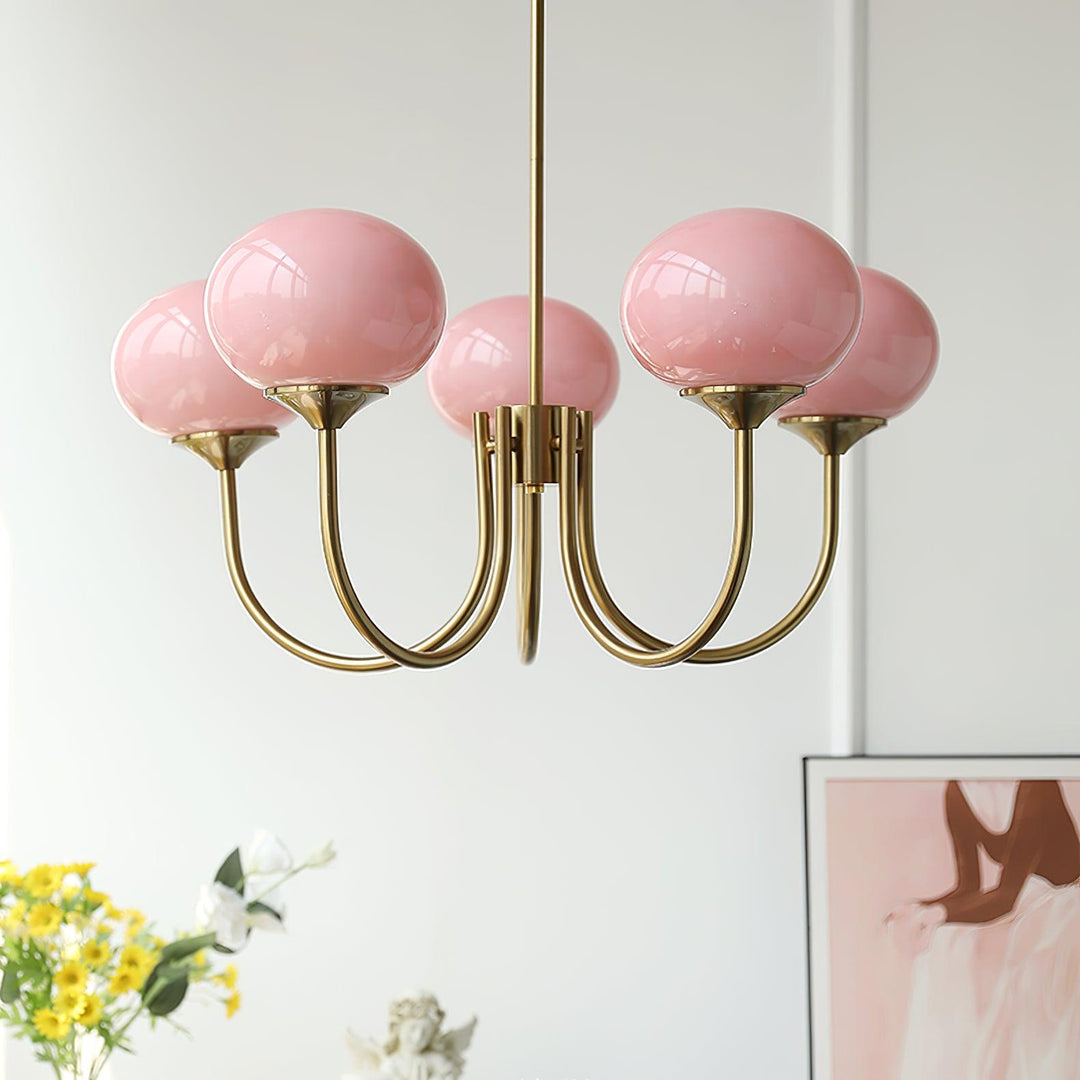 Modern pink and gold chandelier with elegant glass shades, ideal ceiling light fixture for chic home decor and illumination.
