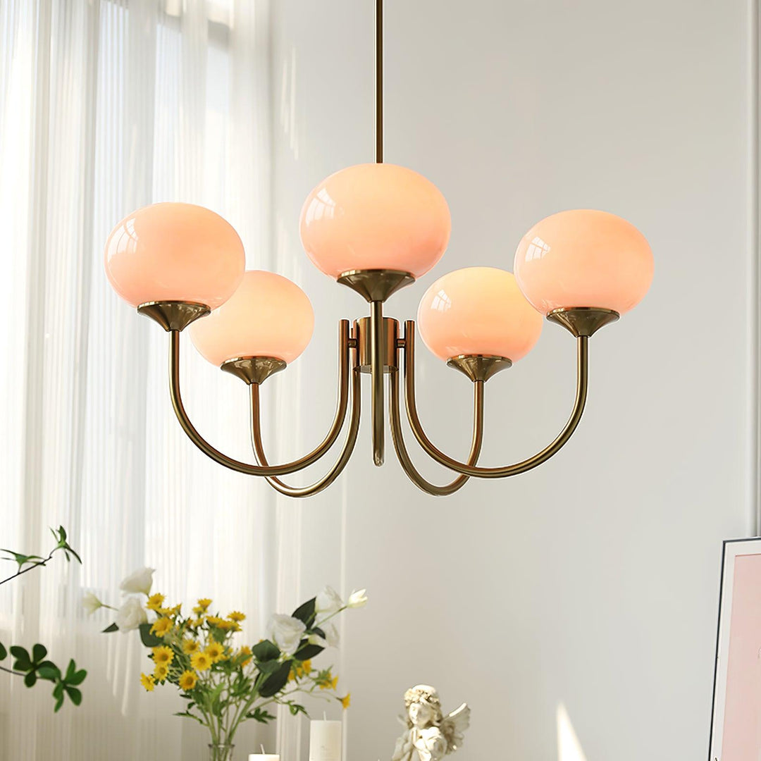 Modern pink and gold chandelier with elegant glass shades, ideal ceiling light fixture for chic home decor and illumination.
