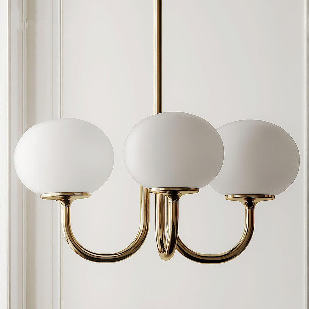 Modern pink and gold chandelier with elegant glass shades, ideal ceiling light fixture for chic home decor and illumination.