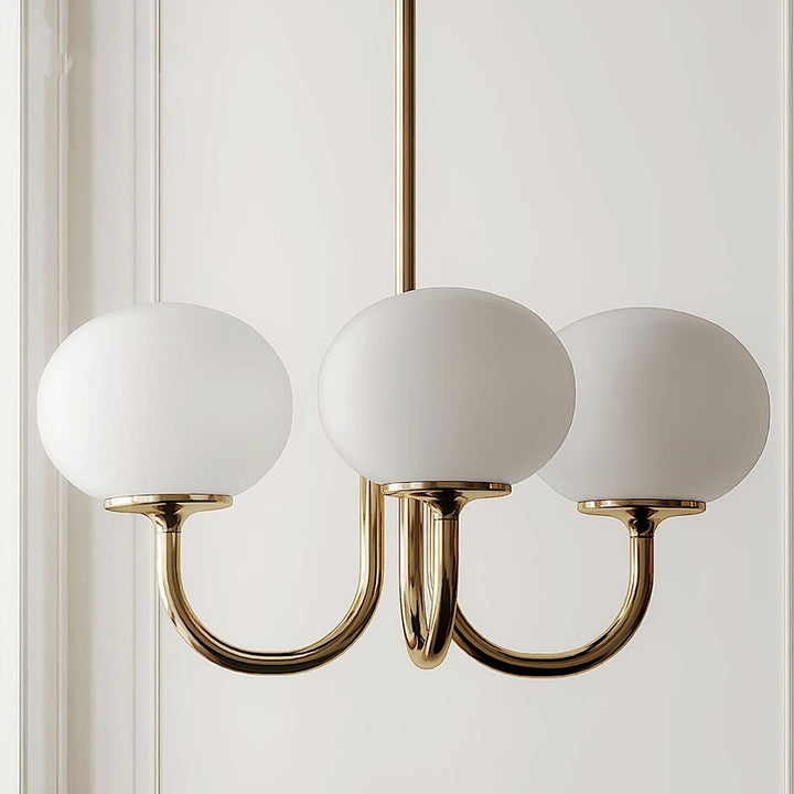 Modern pink and gold chandelier with elegant glass shades, ideal ceiling light fixture for chic home decor and illumination.