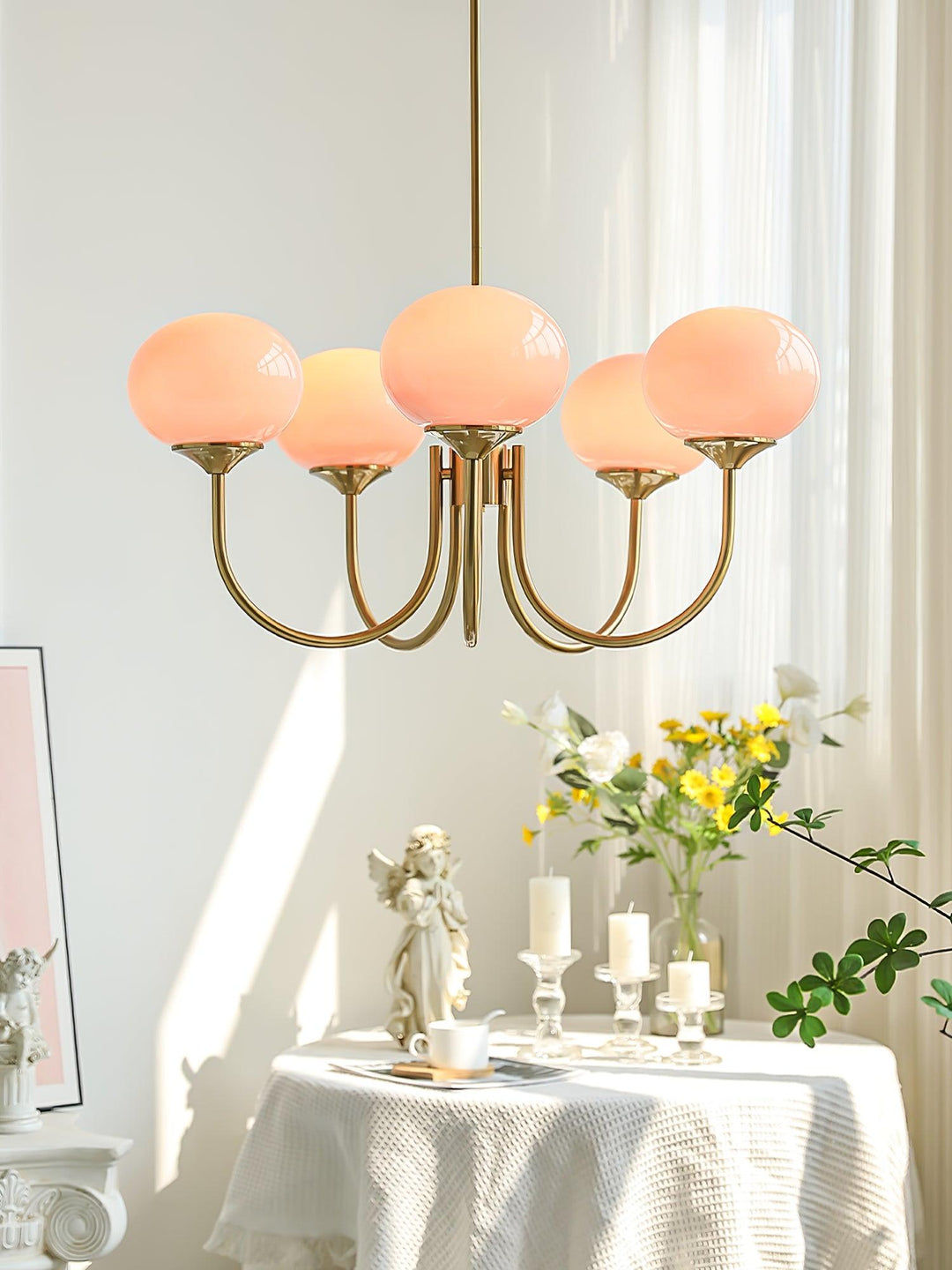 Modern pink and gold chandelier with elegant glass shades, ideal ceiling light fixture for chic home decor and illumination.