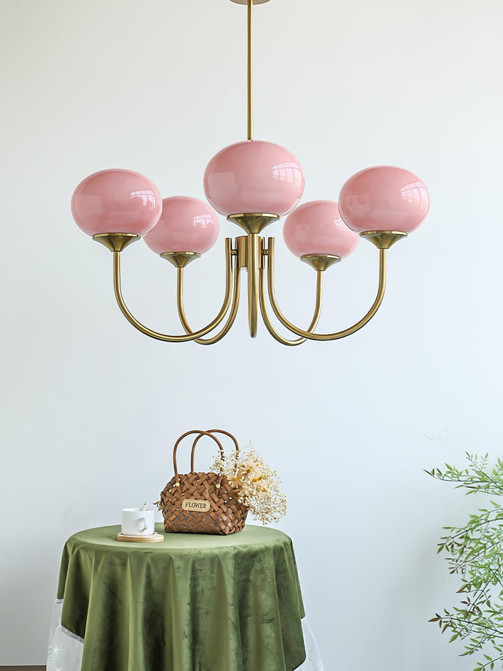 Modern pink and gold chandelier with elegant glass shades, ideal ceiling light fixture for chic home decor and illumination.