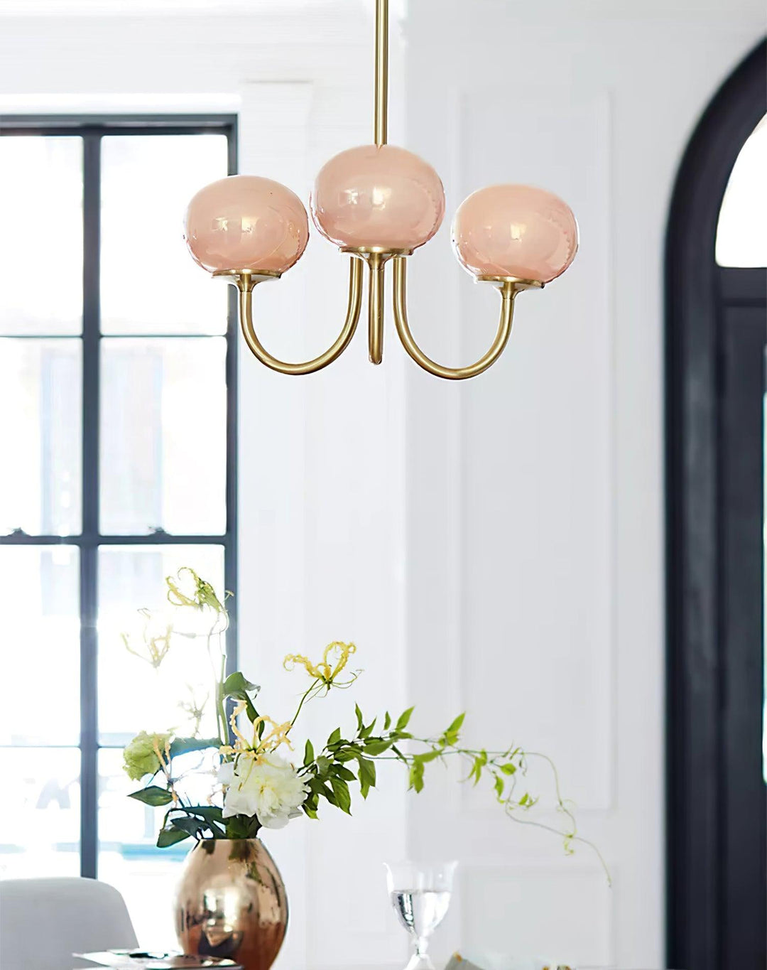 Modern pink and gold chandelier with elegant glass shades, ideal ceiling light fixture for chic home decor and illumination.