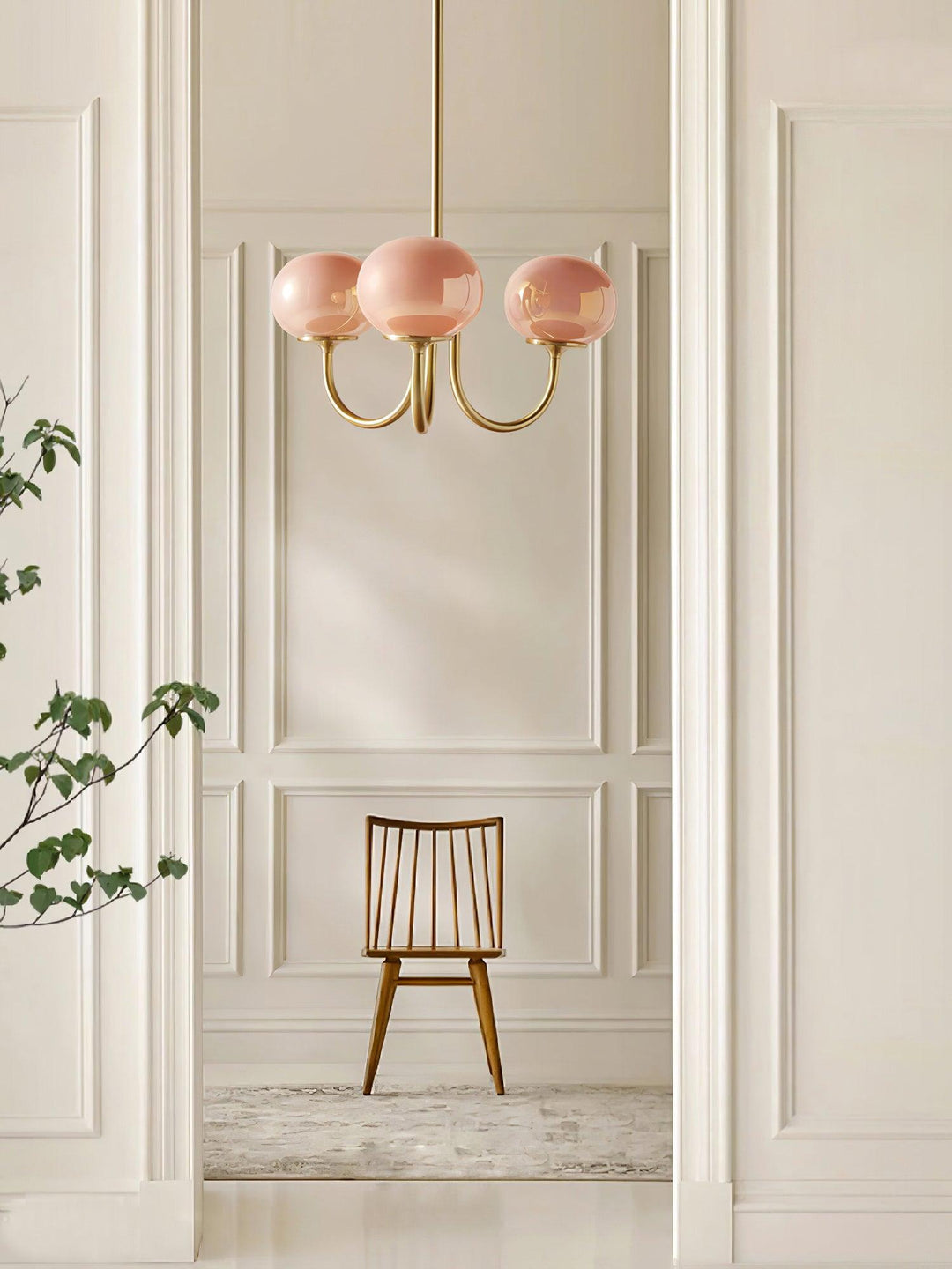 Modern pink and gold chandelier with elegant glass shades, ideal ceiling light fixture for chic home decor and illumination.