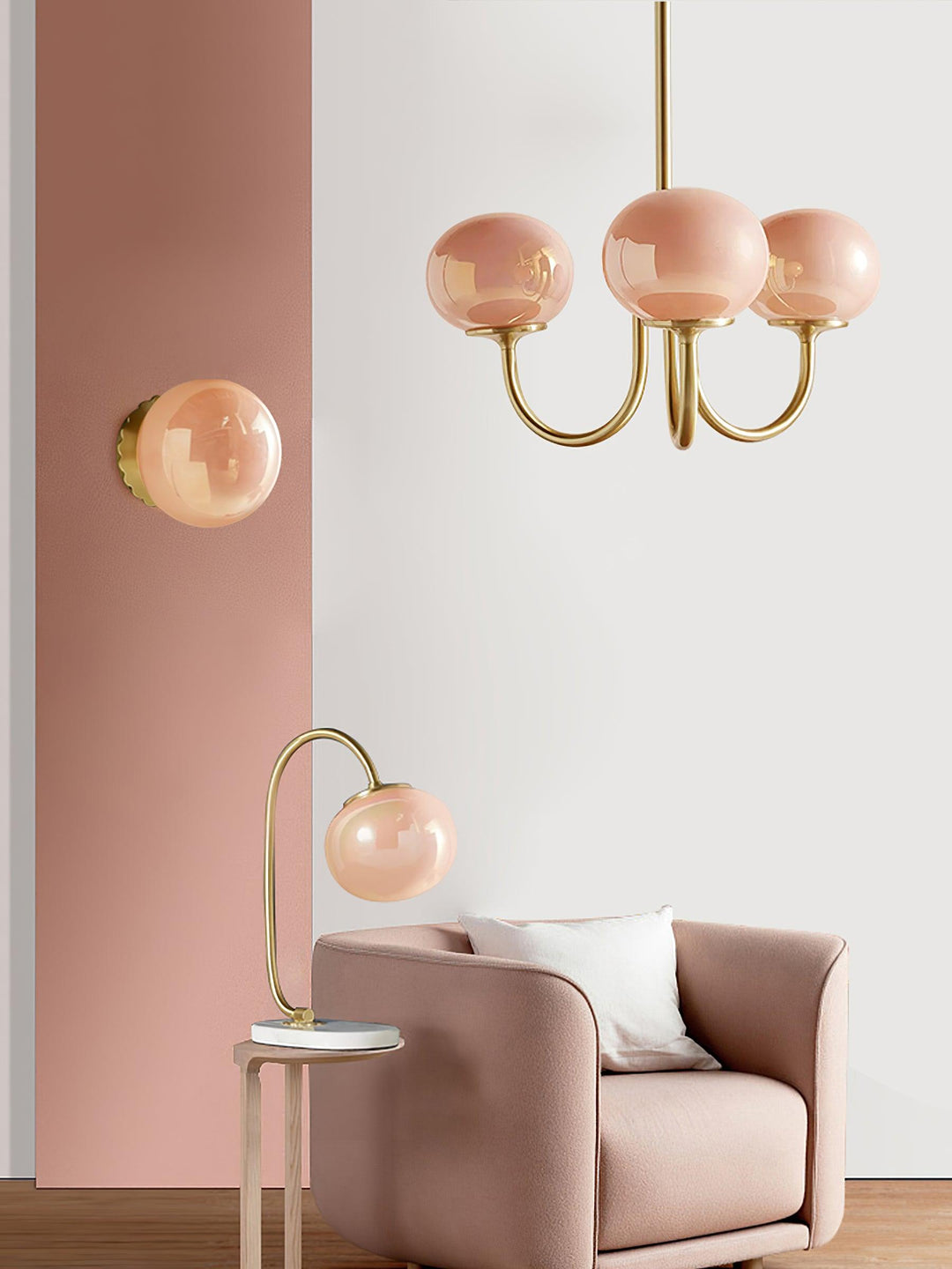 Modern pink and gold chandelier with elegant glass shades, ideal ceiling light fixture for chic home decor and illumination.