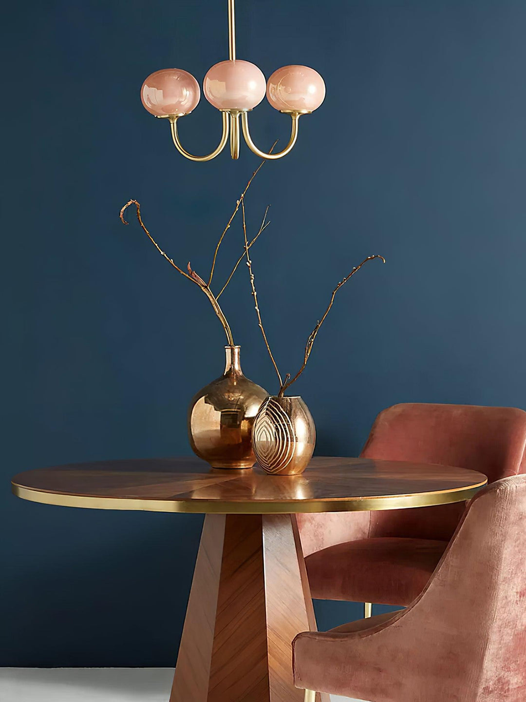 Modern pink and gold chandelier with elegant glass shades, ideal ceiling light fixture for chic home decor and illumination.