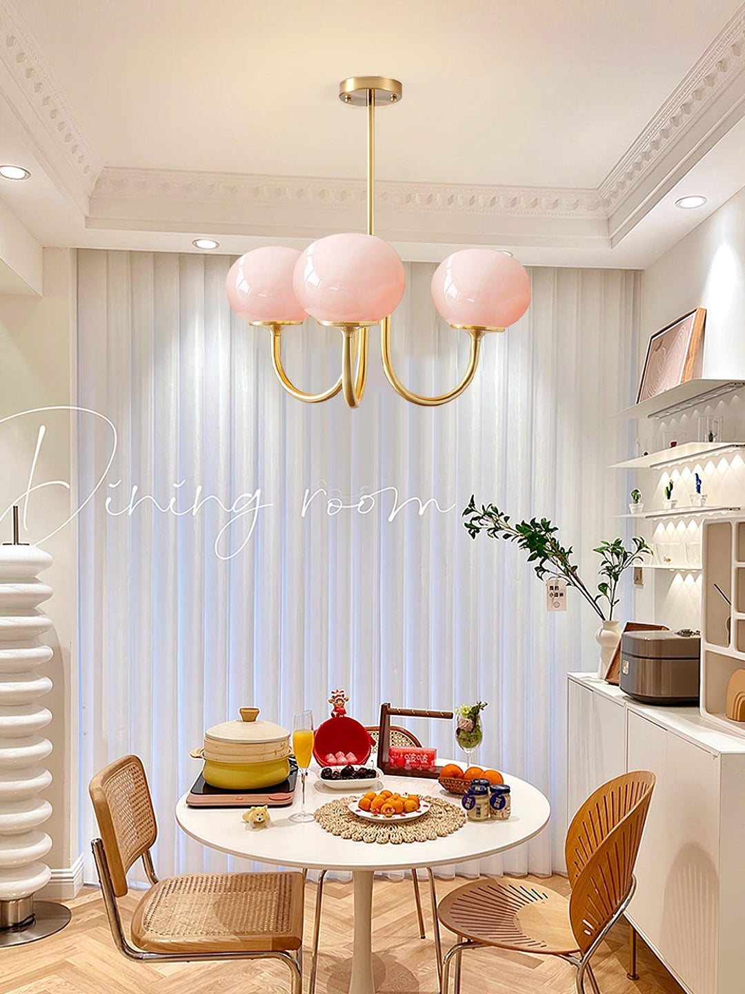 Modern pink and gold chandelier with elegant glass shades, ideal ceiling light fixture for chic home decor and illumination.