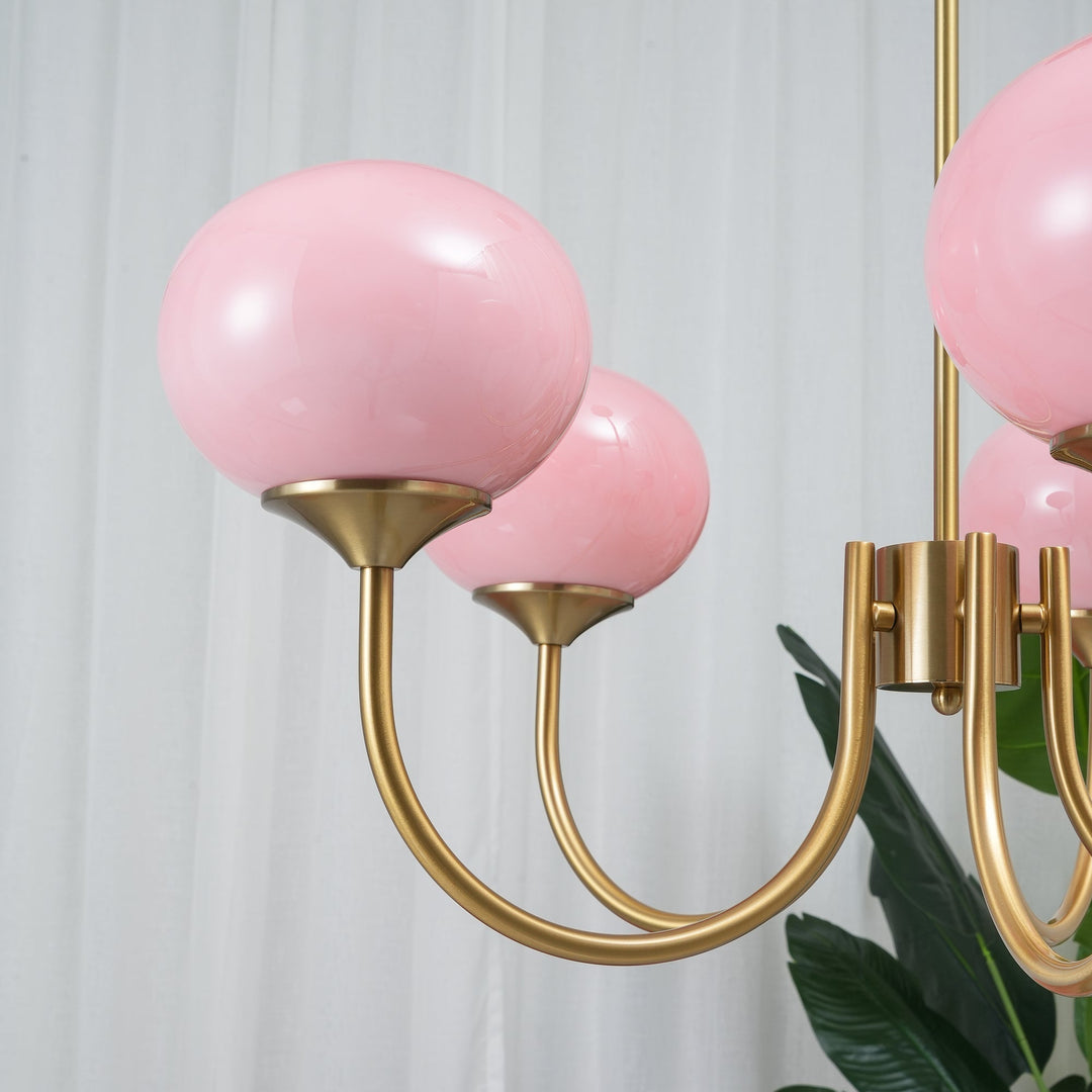 Modern pink and gold chandelier with elegant glass shades, ideal ceiling light fixture for chic home decor and illumination.