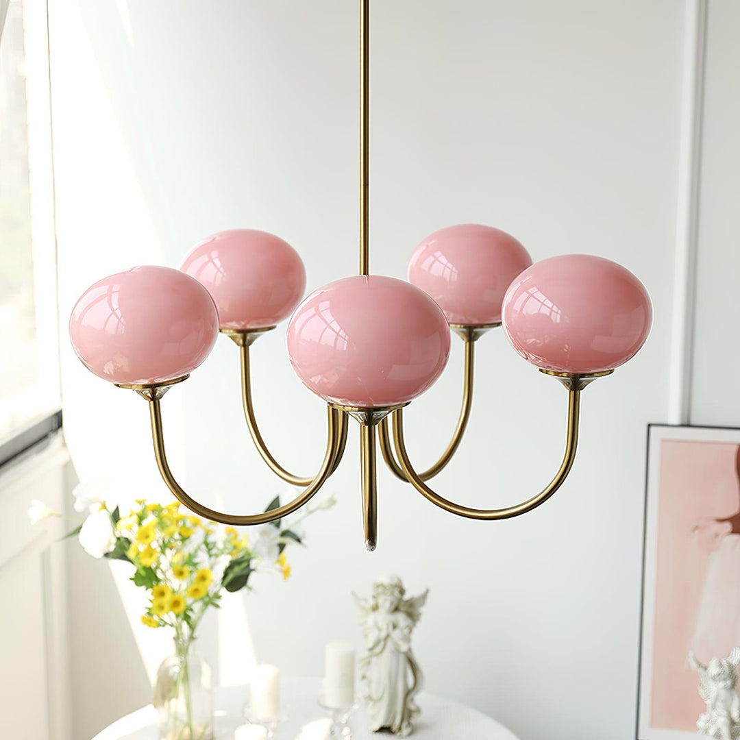 Modern pink and gold chandelier with elegant glass shades, ideal ceiling light fixture for chic home decor and illumination.