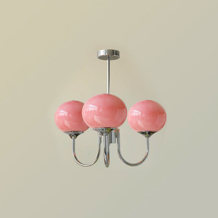 Modern pink and gold chandelier with elegant glass shades, ideal ceiling light fixture for chic home decor and illumination.