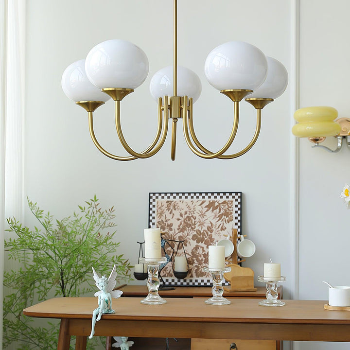 Modern pink and gold chandelier with elegant glass shades, ideal ceiling light fixture for chic home decor and illumination.