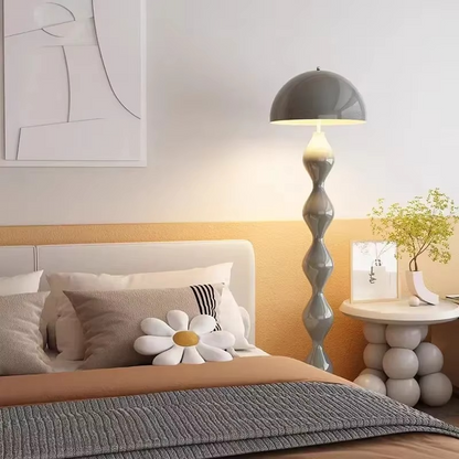 "Modern Scandinavian floor lamp with sleek metal frame and glowing shade in minimalist design for contemporary home decor."