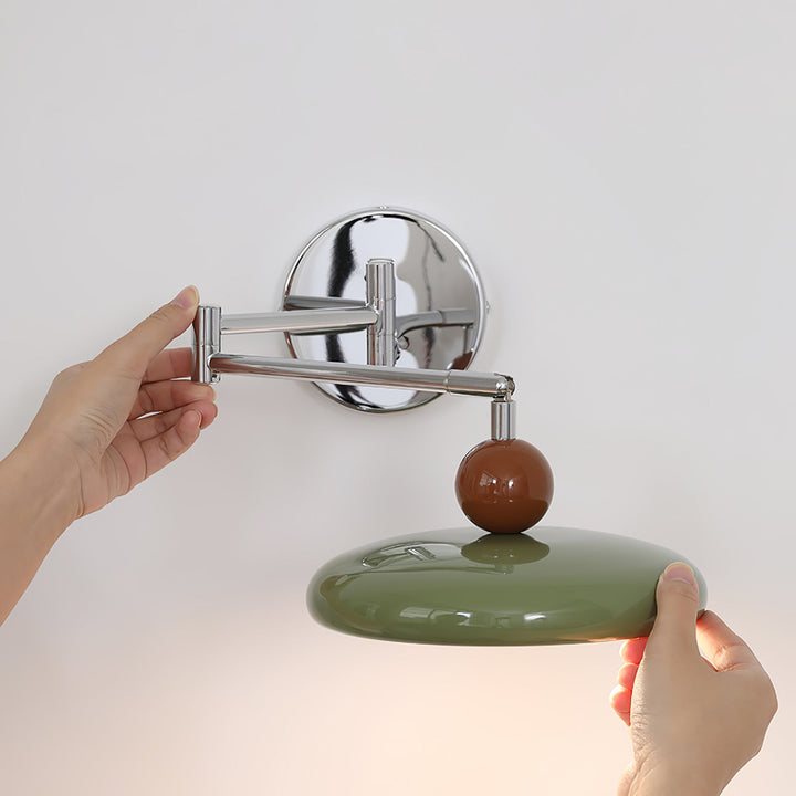 "Modern swing arm wall lamp with adjustable metal arm, acrylic base, integrated LED, beige and green color options."