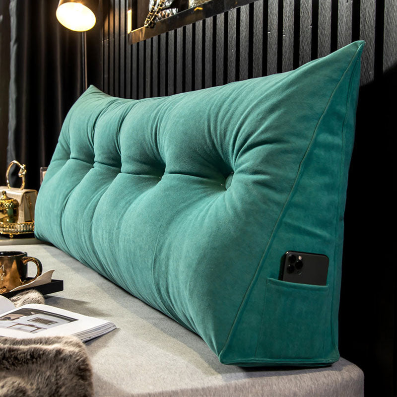 "Multi-coloured ergonomic wedge pillow for back support; shown in brown, yellow, and orange with a handy side pocket."