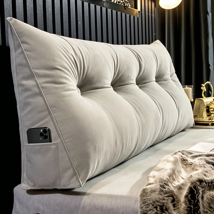 "Multi-coloured ergonomic wedge pillow for back support; shown in brown, yellow, and orange with a handy side pocket."